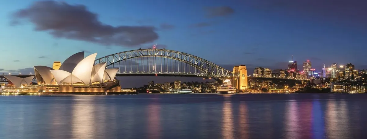 Sydney Opera House and Harbour Bridge lit up at night